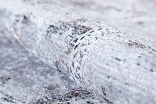 Load image 1 in gallery view. A close-up of the Heritage Jewel - Washable Rug - JR1778 (Custom Size), featuring a light gray and white marbled pattern with subtle brown hints and dark specks—durable, easy-to-clean, and perfect for high-traffic areas.