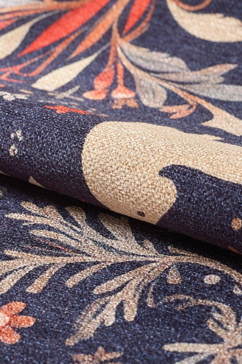 Load image 1 in gallery view. Close-up of the Holiday Heart Washable Area Rug - MDJ001 shows a textured fabric with cream birds, leaves, and pink flowers on dark blue. This multicolor rug is ideal for high-traffic areas and highlights its intricate decorative pattern.