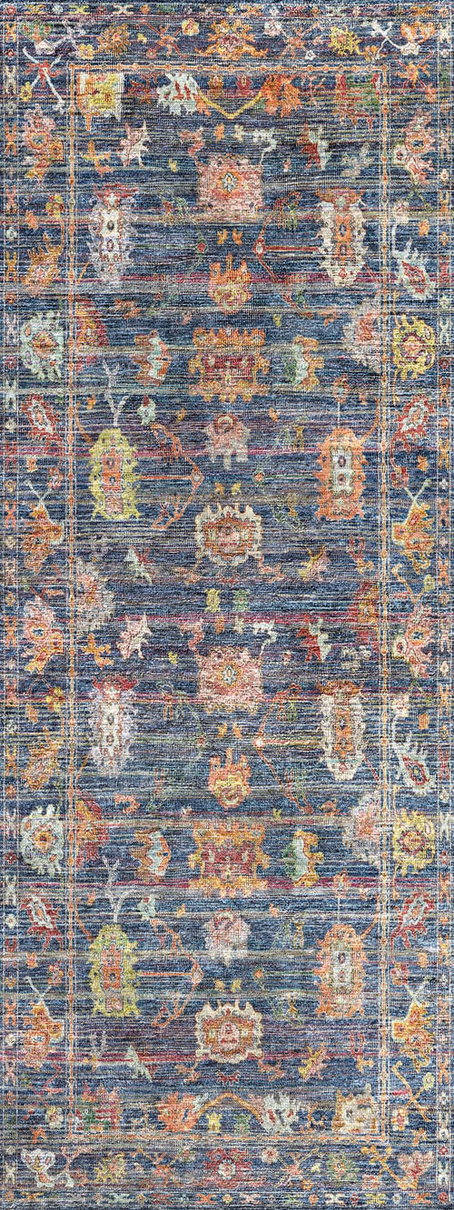 Load image 1 in gallery view. Navy blue rug with a distressed, multi-colored traditional medallion pattern and a bordered frame.