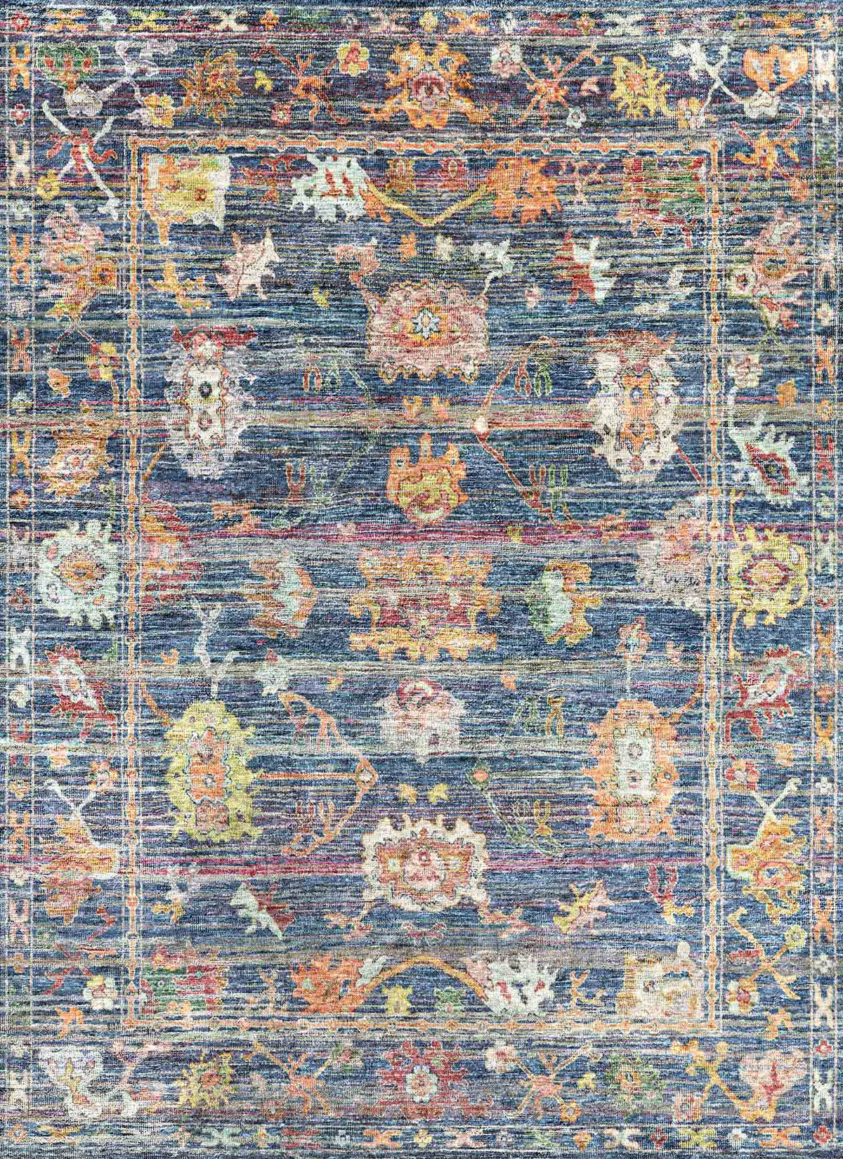 Navy blue traditional rug with a distressed finish and multicolored floral medallion patterns.