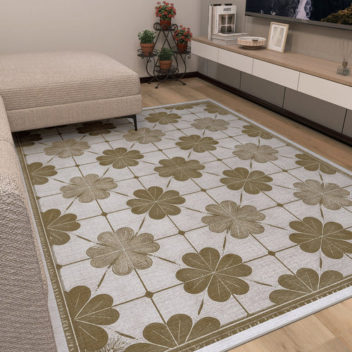 Load image 1 in gallery view. A living room with a beige sofa and the Ivory Clover - Washable Rug (JRS014), featuring bold clover patterns for a floral touch—ideal for busy spaces. Potted plants and a low TV unit bring added coziness to the room.