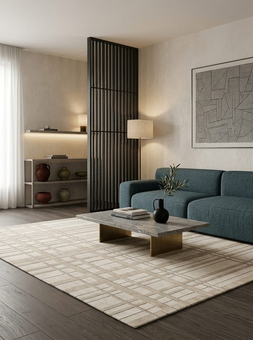 Bild 1 in Galerieansicht laden. Beige and cream rug with a linear grid pattern, styled in a modern living room with a teal sofa.