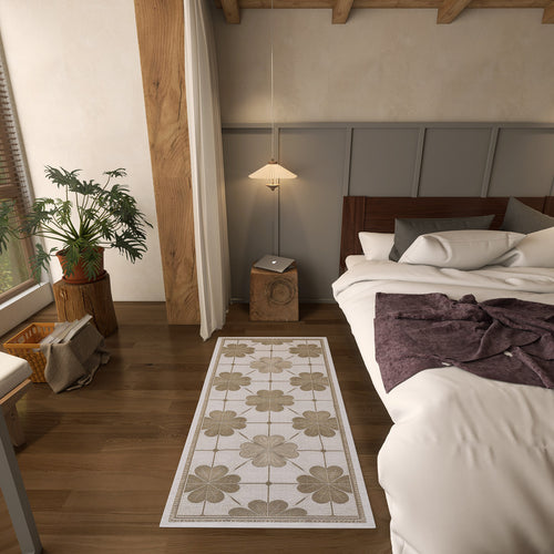 Load image 1 in gallery view. Cream and beige runner rug with a repeating floral grid pattern, styled in a modern bedroom.
