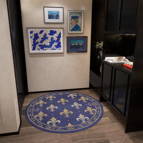 Load image 1 in gallery view. Round blue rug with a gold fleur-de-lis pattern, styled in a modern entryway.