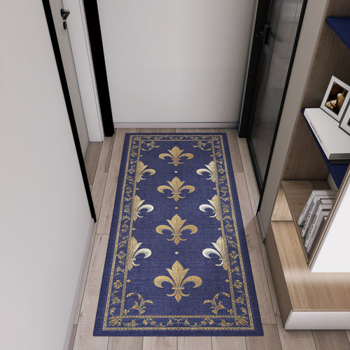 Load image 1 in gallery view. Navy blue runner rug with a gold fleur-de-lis pattern and ornate border, styled in a modern hallway.