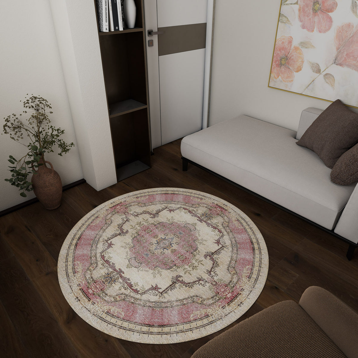 Round cream and pink medallion rug with a distressed traditional pattern, styled in a modern living room.