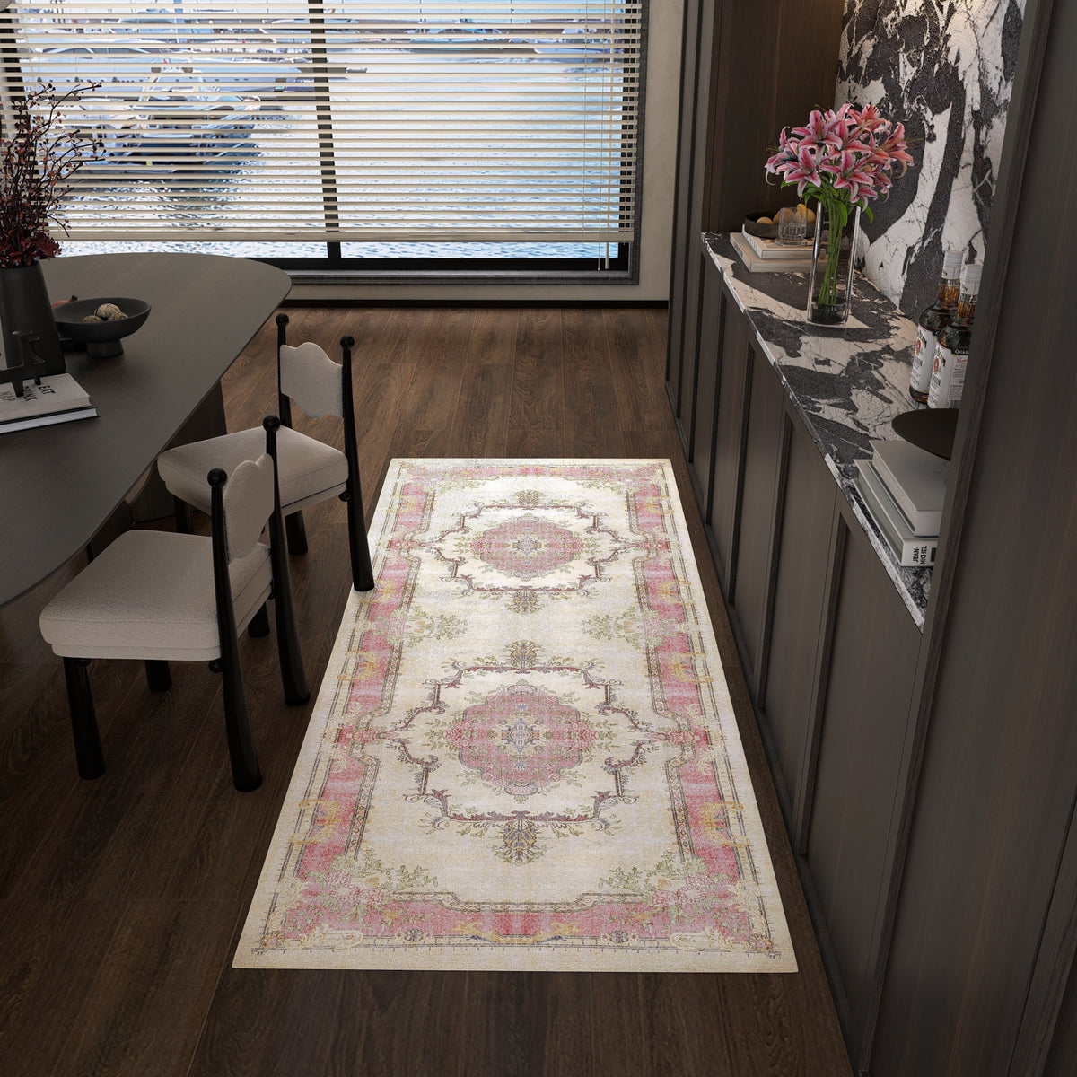 Cream runner rug with pink and sage green traditional medallion patterns, styled in a modern dining room.