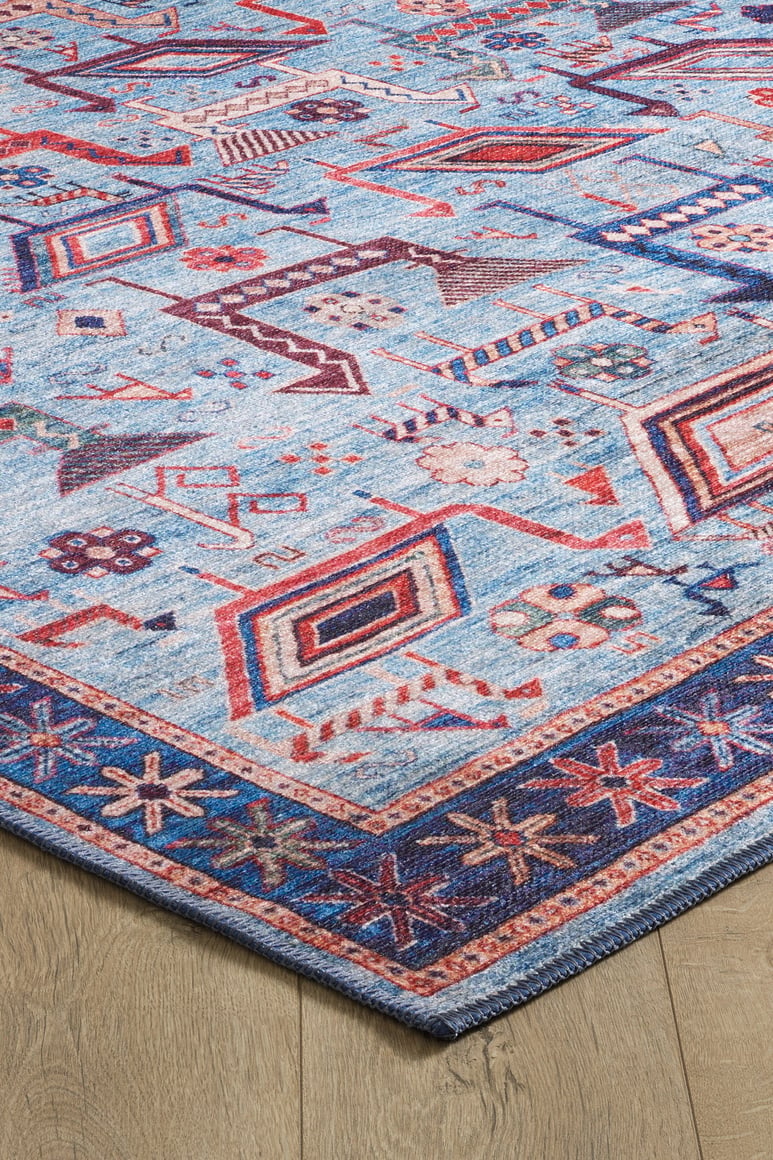 The Birdwatcher's Dream Blue Washable Rug - LCC3020 (Custom Size) features geometric and floral patterns in blue, red, pink, and cream with a decorative border—perfect for high-traffic areas on wooden floors.