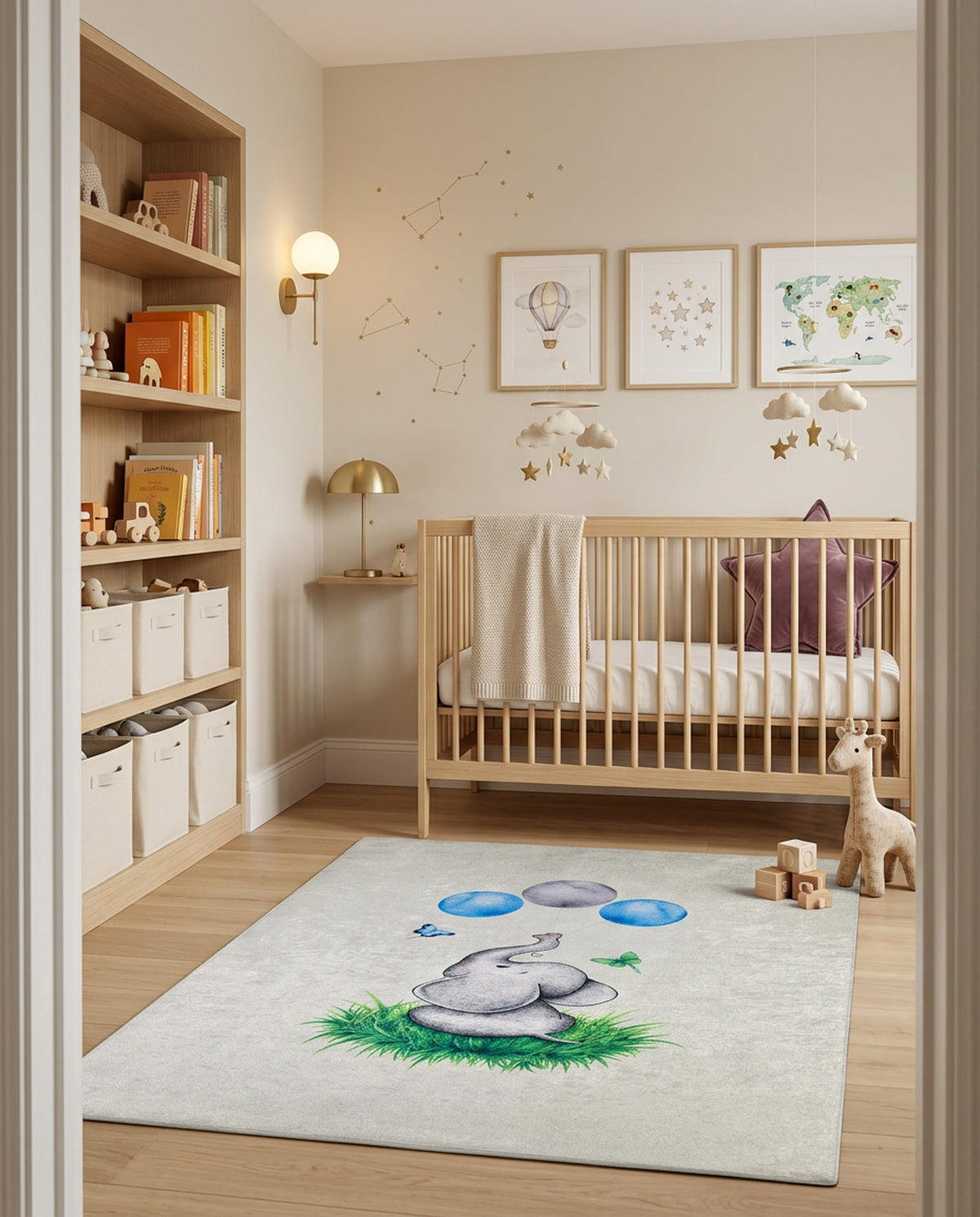 Light gray rug featuring a watercolor elephant, green grass, and blue balloons, styled in a nursery.