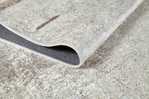 Load image 1 in gallery view. A close-up of the Kaleidoscope Dreams - Washable Rug - JR5055 (Custom Size) in beige and brown with a folded corner, highlighting its woven texture and detailed edging—perfect for high-traffic or allergy-sensitive spaces.
