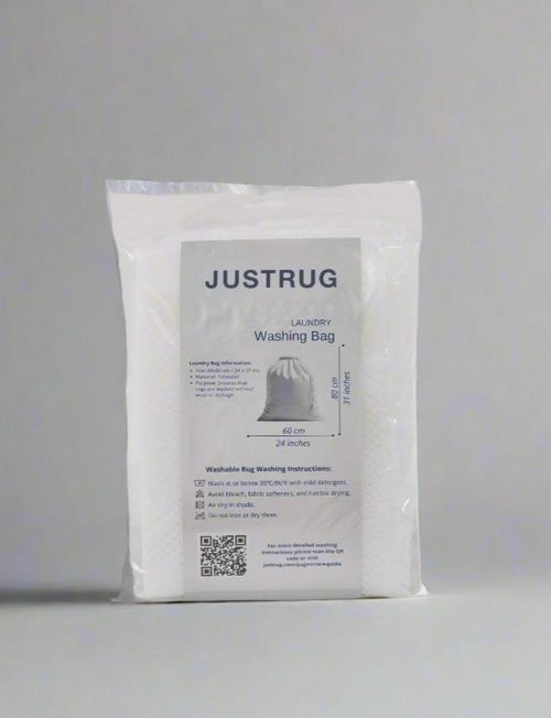 Load image 1 in gallery view. A clear package of Laundry Washing Bag, labeled with washing instructions and product details, stands upright against a gray background. Inside, a white mesh laundry bag for washable rugs is visible.