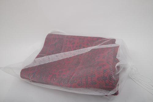 Load image 1 in gallery view. A red and black patterned fabric is partially covered by the Laundry Washing Bag, a white drawstring bag set on a plain background—ideal for protecting washable rugs during cleaning.