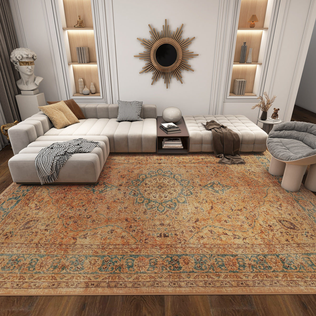 Modern living room with a large beige sectional, accent pillows, sunburst mirror, built-in shelves, classical bust, and the Classic Laurel - Washable Rug - JRN1022 covering the wooden floors.