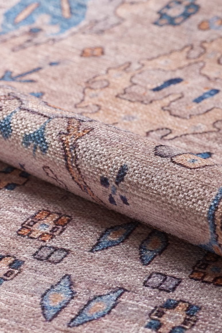 A close-up of the Luminary Beige Gray Washable Rug - LCC3023 (Custom Size) shows its blue, brown, and cream geometric and floral patterns. Durable and washable, its intricate design suits high-traffic areas.