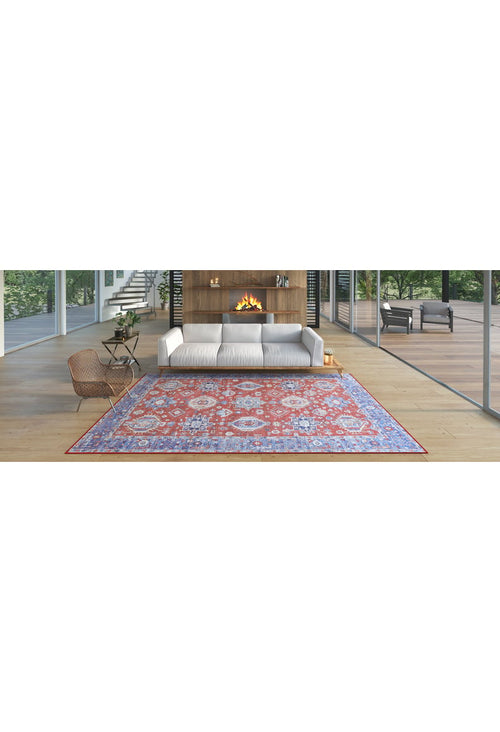Load image 1 in gallery view. A modern living room with a white sofa, round chair, wooden fireplace, glass walls, and the Lunavale Red Blue Washable Rug - LCC3007 (Custom Size) featuring purple patterns on light wood floors—ideal for high-traffic areas.