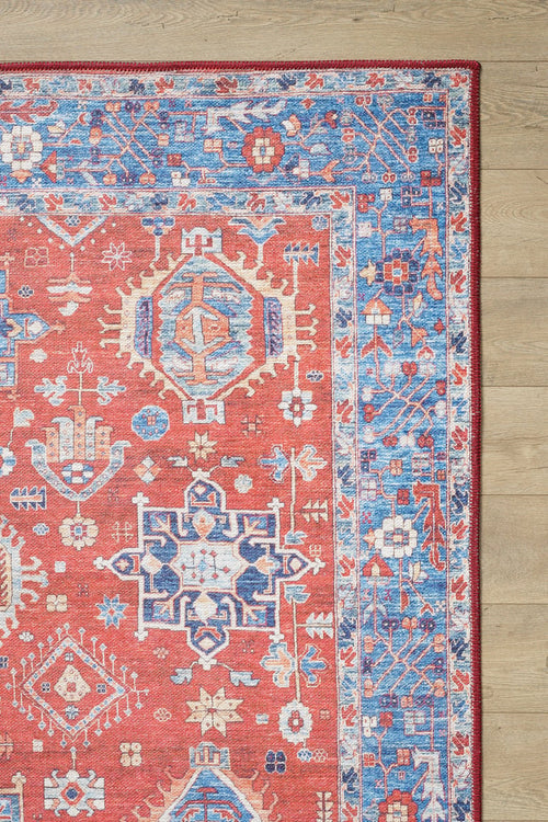 Load image 1 in gallery view. The Lunavale Red Blue Washable Rug - LCC3007 (Custom Size) features geometric and floral motifs with a blue ornamental border. Its durable, washable design makes it ideal for high-traffic areas and adds style to wooden floors.