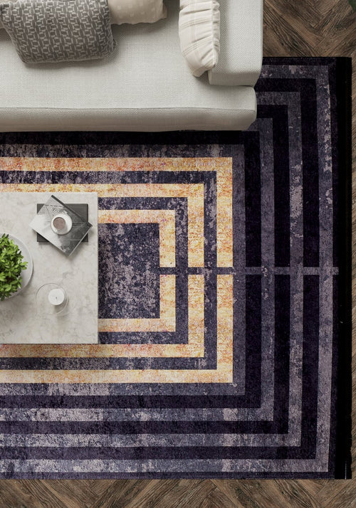 Bild 1 in Galerieansicht laden. Modern living room with a white sofa, Minimalist and Clean - Washable Rug - JR1407 (Custom Size) in concentric purple and gold rectangles, marble coffee table with plant, candle, books—all on durable herringbone flooring.