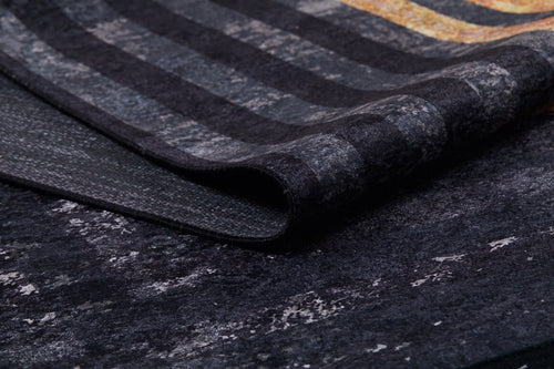 Bild 1 in Galerieansicht laden. A close-up of the Minimalist and Clean - Washable Rug - JR1407 (Custom Size) reveals its textured striped pattern in gray, black, and gold tones—perfect for high-traffic areas. The rug is slightly folded to show both surface and underside.