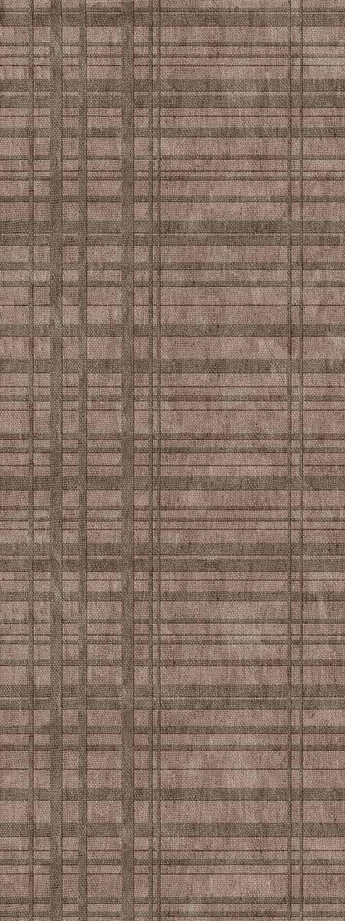 Taupe area rug with a grid pattern of intersecting horizontal and vertical lines.