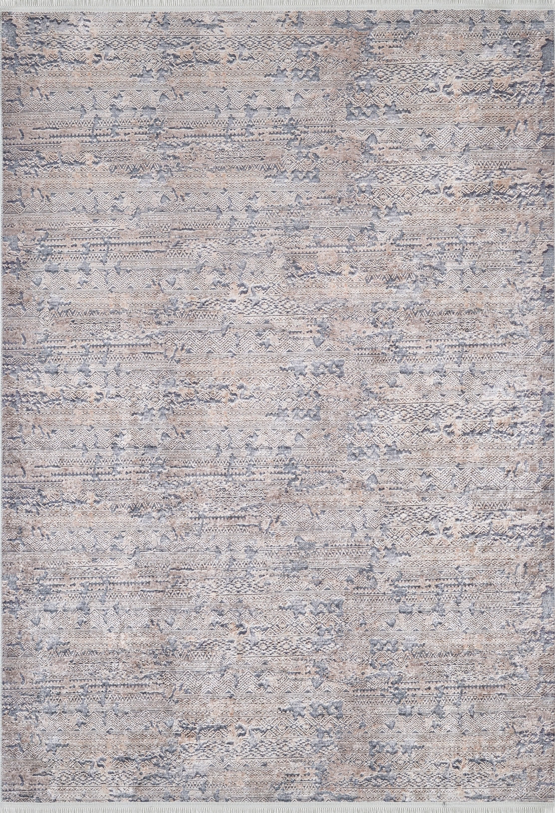 The Modern Enigma - Machine-Washable Rug JR1883 features a textured abstract pattern in grey, blue, and beige. Its subtle design, durable build, and slightly fringed edges make it ideal for high-traffic, modern neutral spaces.