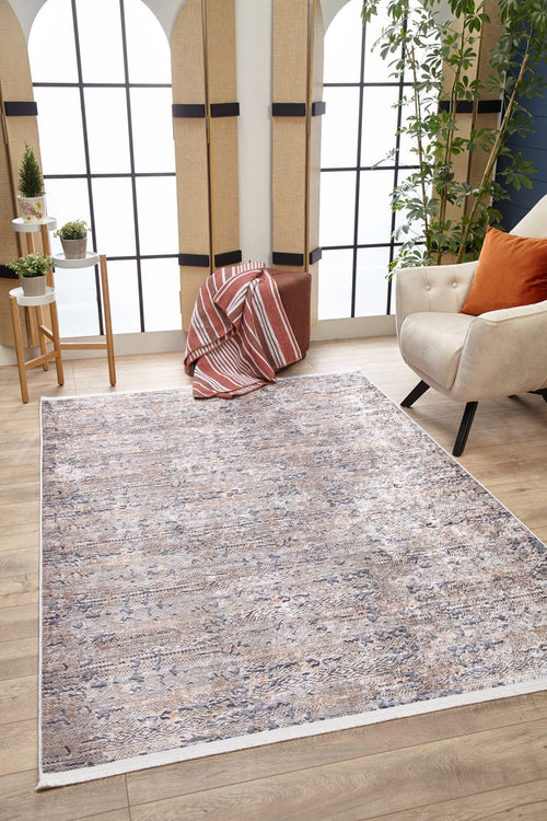 Load image 1 in gallery view. A cozy living room featuring the Modern Enigma - Machine-Washable Rug JR1883 (Custom Size) in cream and beige on a wooden floor, a beige armchair with orange pillows, potted plants, and a striped blanket—perfect for high-traffic areas and easy to clean.