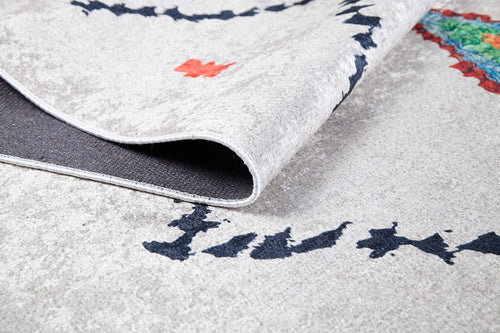 Load image 1 in gallery view. A close-up of the Moroccan Mosaic - Washable Rug - JR1655 (Custom Size) shows its light color, subtle black pattern, small orange detail, multicolored section, and dark textured backing—perfect for high-traffic areas.