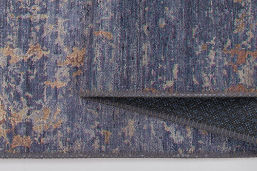 Load image 1 in gallery view. A close-up of the Mystical Mosaic - Washable Rug - JRS003 (Outlet) US in blue, purple, beige, and brown highlights its textured surface, neat stitching, folded corner, and black non-slip underside—perfect for high-traffic areas.