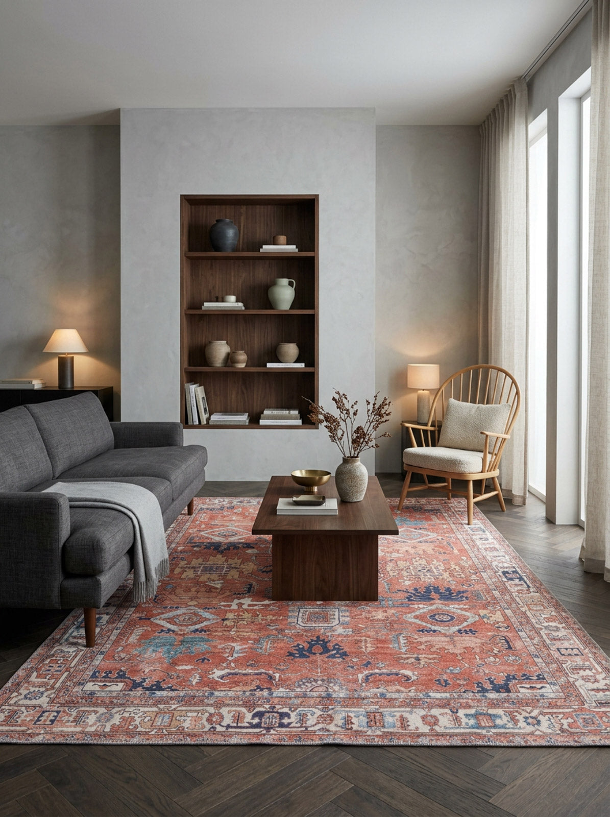 Terracotta, blue, and cream traditional Persian-style rug with a distressed finish in a modern living room.