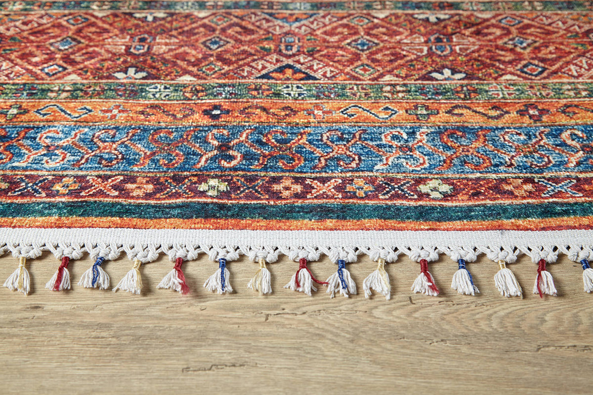 The Native Nightscape - Washable Rug - JR5093 (Custom Size) features vibrant geometric patterns and multicolor fringe, adding style to any light wooden floor—ideal for high-traffic areas.