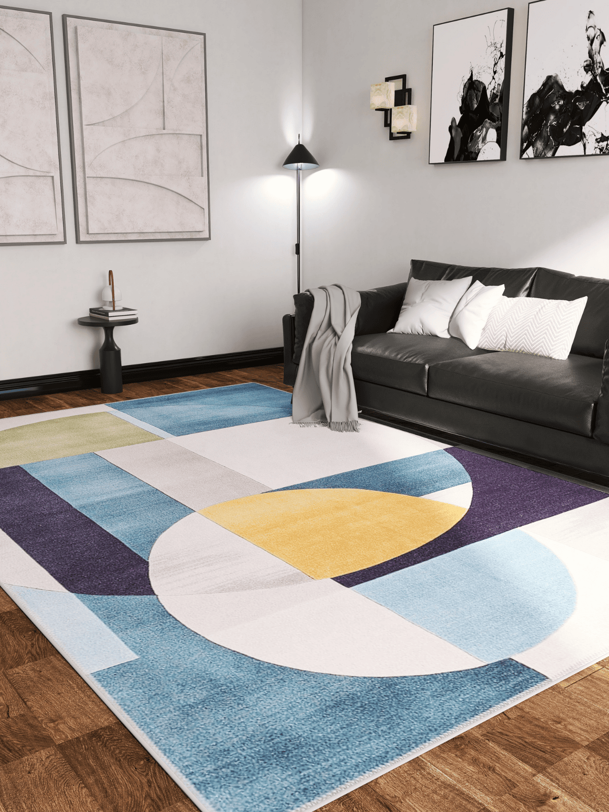 Modern living room with a dark gray sofa, gray throw, abstract wall art, standing lamp, and the Nexus Geometric Contemporary Washable Rug - MDJ006 featuring blue, yellow, white, and green shapes—ideal for high-traffic areas.