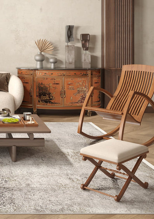 Load image 1 in gallery view. A living room features a cream sofa, wooden coffee table on a Noble Insignia - Washable Rug - JR1830 (Outlet) US, and two wooden chairs. An orange lacquered cabinet with Asian-style art and modern décor stands against the back wall.