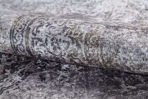 Bild 1 in Galerieansicht laden. A close-up of the Noble Insignia - Washable Rug - JR1830 (Custom Size) shows its rolled, textured gray surface with a faded, intricate pattern and subtle shade variations—perfect for high-traffic areas.