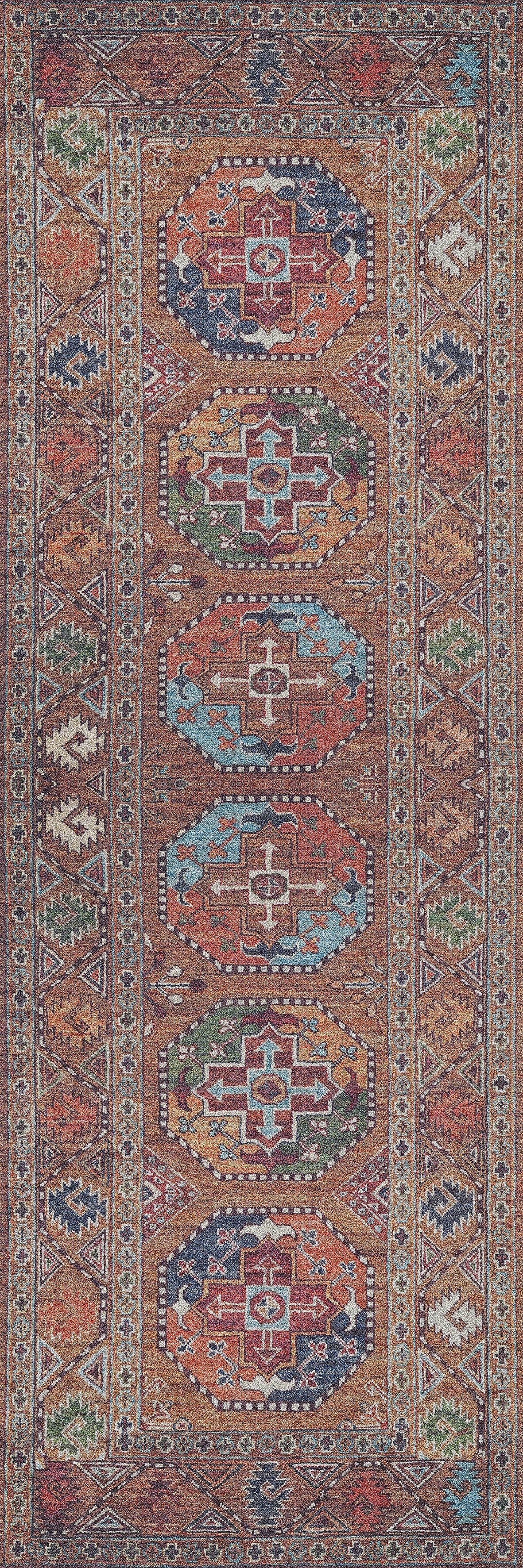 The Nomadic Oasis - Washable Rug - JR5086 features a traditional flat weave with geometric patterns in red, brown, blue, white, and green. Its central hexagonal medallions and angular motif border create an intricate, symmetrical design.