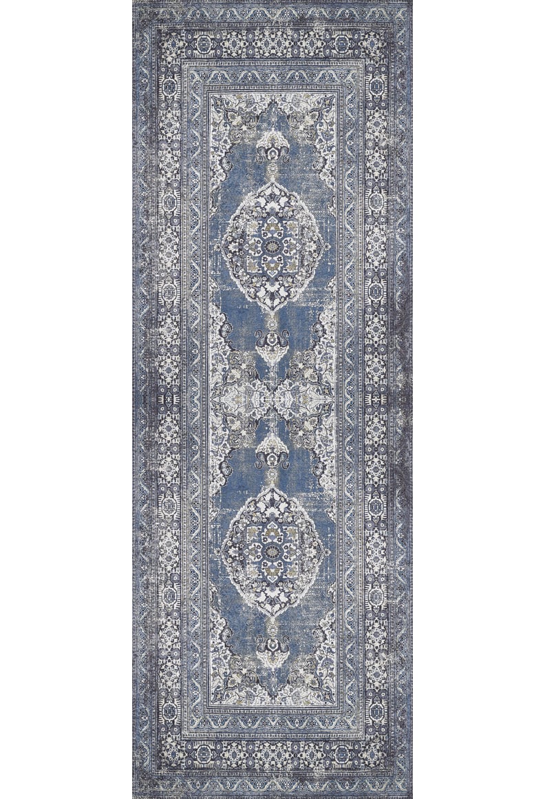 The Opulent Beauty - Washable Rug - JR1932 is a rectangular blue rug with an intricate symmetrical pattern in blue, white, and gray, featuring central medallions and ornate borders—ideal for high-traffic areas.