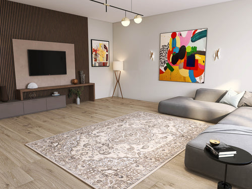 Load image 1 in gallery view. Modern living room with the Opulent Mirage - Washable Rug (JRN1008) in a subtle medallion design, gray sectional sofa, TV on wood-paneled wall, abstract art, floor lamp, light wood flooring, and minimalist decor.