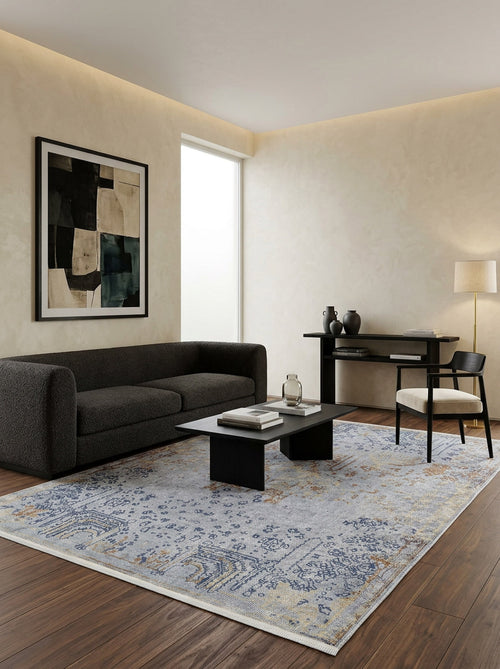 Bild 1 in Galerieansicht laden. Light blue and tan traditional distressed medallion rug in a modern living room with dark furniture.