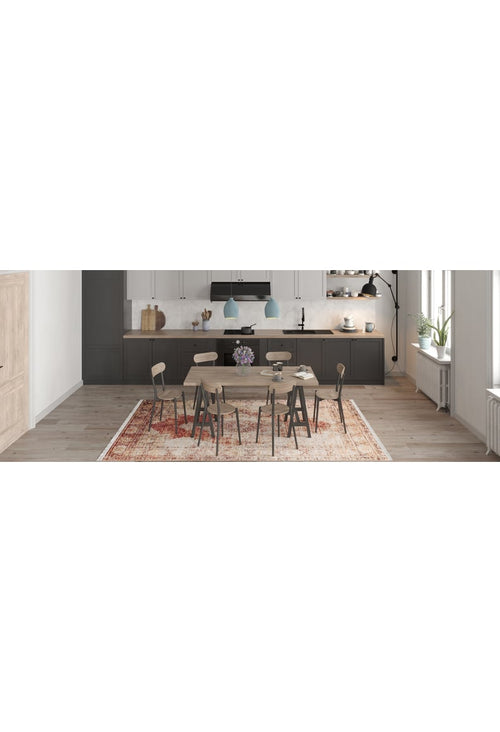 Load image 1 in gallery view. A modern kitchen on light wood floors features the Ornate Grace - Washable Rug - JR1009 (Outlet) US, dark lower cabinets, white uppers, a spacious countertop, pendant lights, a wood dining table, and a vase of purple flowers adding vibrancy—ideal for busy spaces.