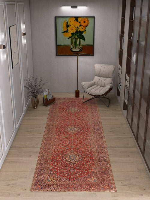 Load image 1 in gallery view. A cozy reading nook with a soft chair, floor lamp, vase of twigs, and a long Palatial Grace - Washable Rug - JRN1021 (Custom Size). Sunflower painting, framed art decorate the walls; shelves are visible on the right.