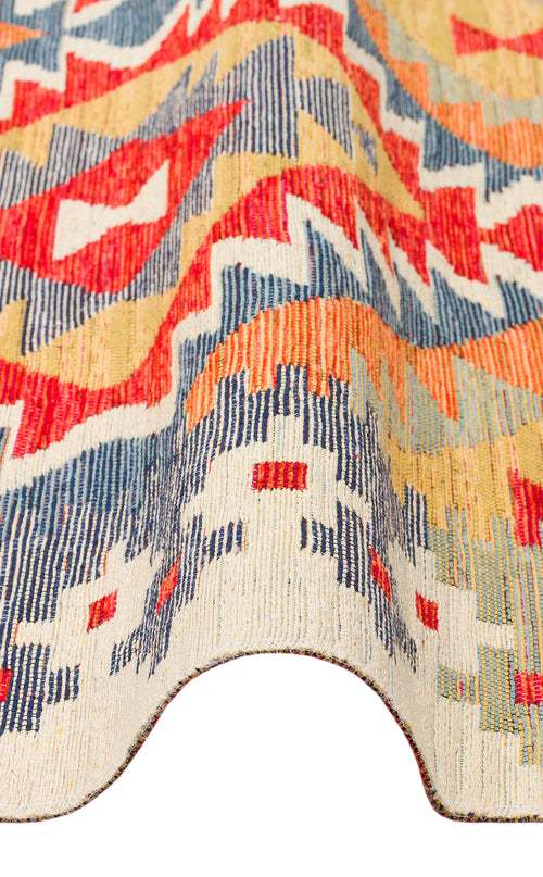 Load image 1 in gallery view. A close-up of the Pastel Grid - Washable Reversible Kilim - NMD09 shows a colorful geometric pattern in red, blue, orange, and cream. The Southwestern rug is folded to highlight its rich texture and substantial thickness.