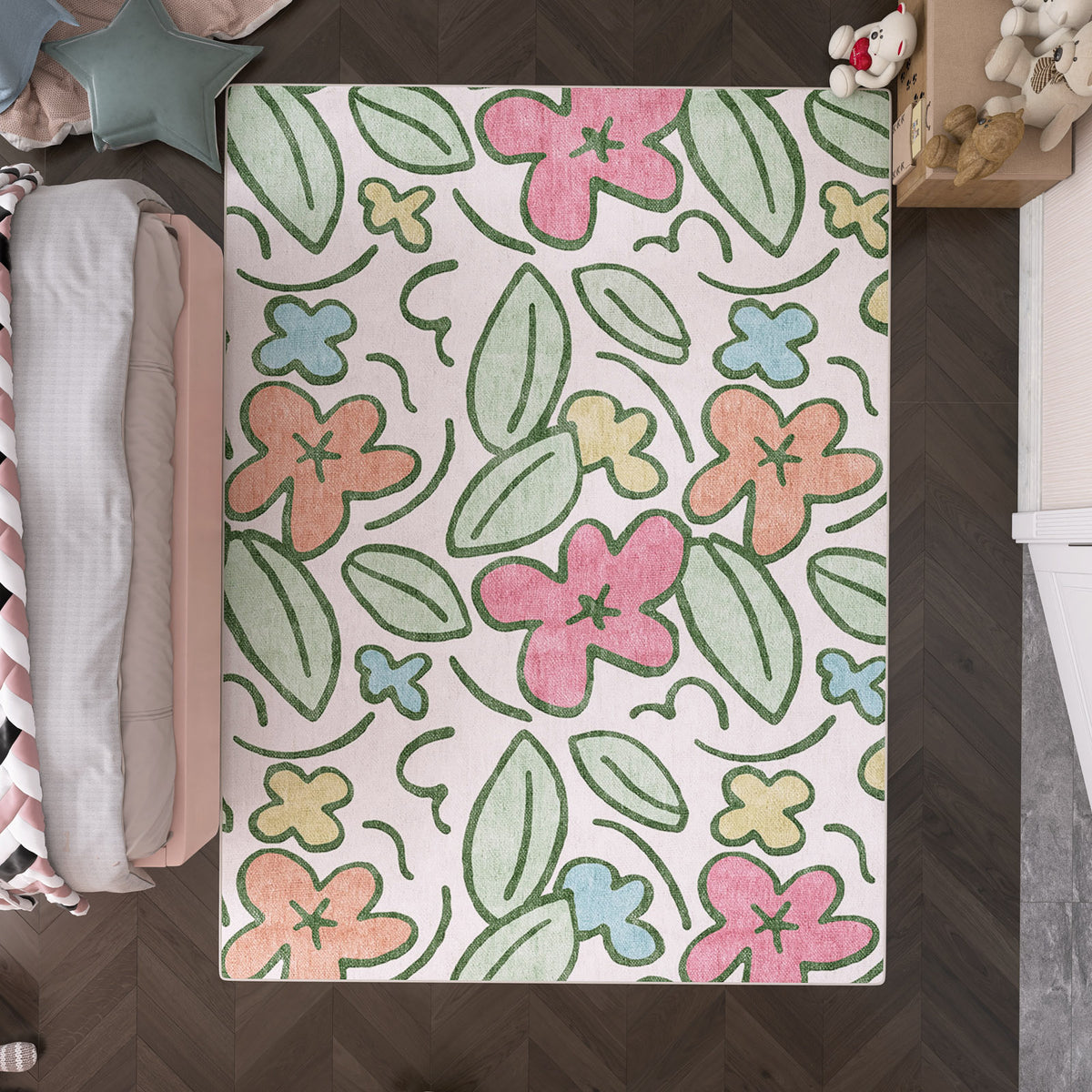 Off-white rug with a colorful floral and leaf pattern in a child's bedroom.