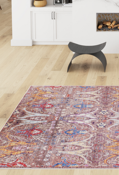Load image 1 in gallery view. The Peregrine Peachy Brown Washable Rug - LCC3022 (Custom Size) adds color and pattern to a modern living room with white cabinetry, a fireplace, woven basket, and black curved stool—great for high-traffic spaces.