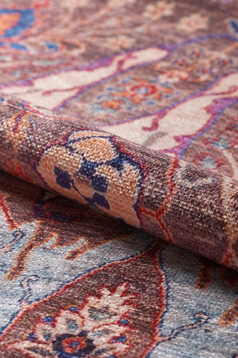 A close-up of the Peregrine Peachy Brown Washable Rug - LCC3022 (Custom Size) highlights its intricate floral pattern and durable, washable design—ideal for high-traffic areas while showcasing detailed texture in warm tones.
