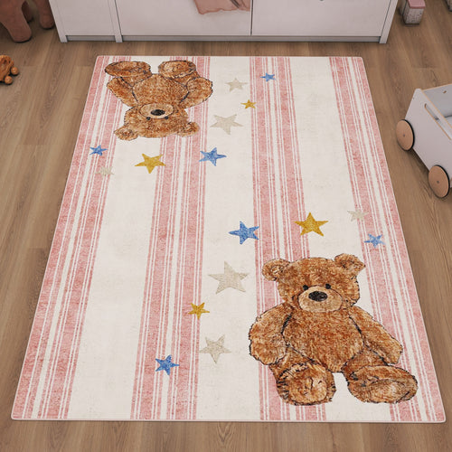 Load image 1 in gallery view. White and pink striped rug with teddy bear and star motifs, styled in a child's bedroom.