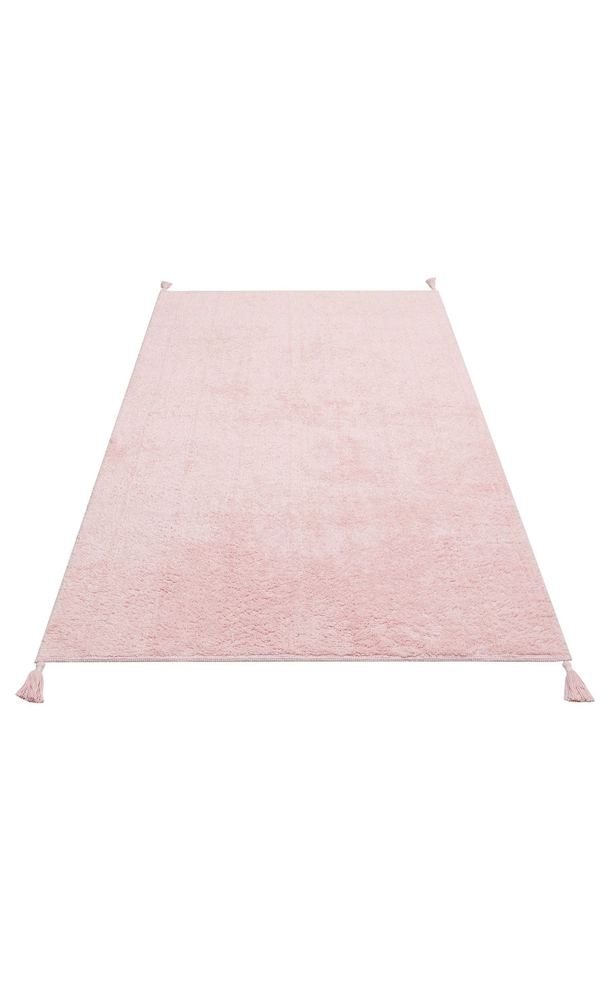 The Powder Calm - Washable Shaggy (CBNPLAIN) is a rectangular pink cotton rug with a soft texture and corner tassels, ideal as a modern bedroom accent, shown on a white background.