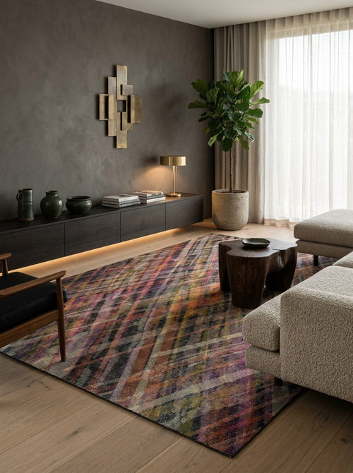 Load image 1 in gallery view. Multicolor abstract plaid rug with intersecting diagonal lines in a modern living room.