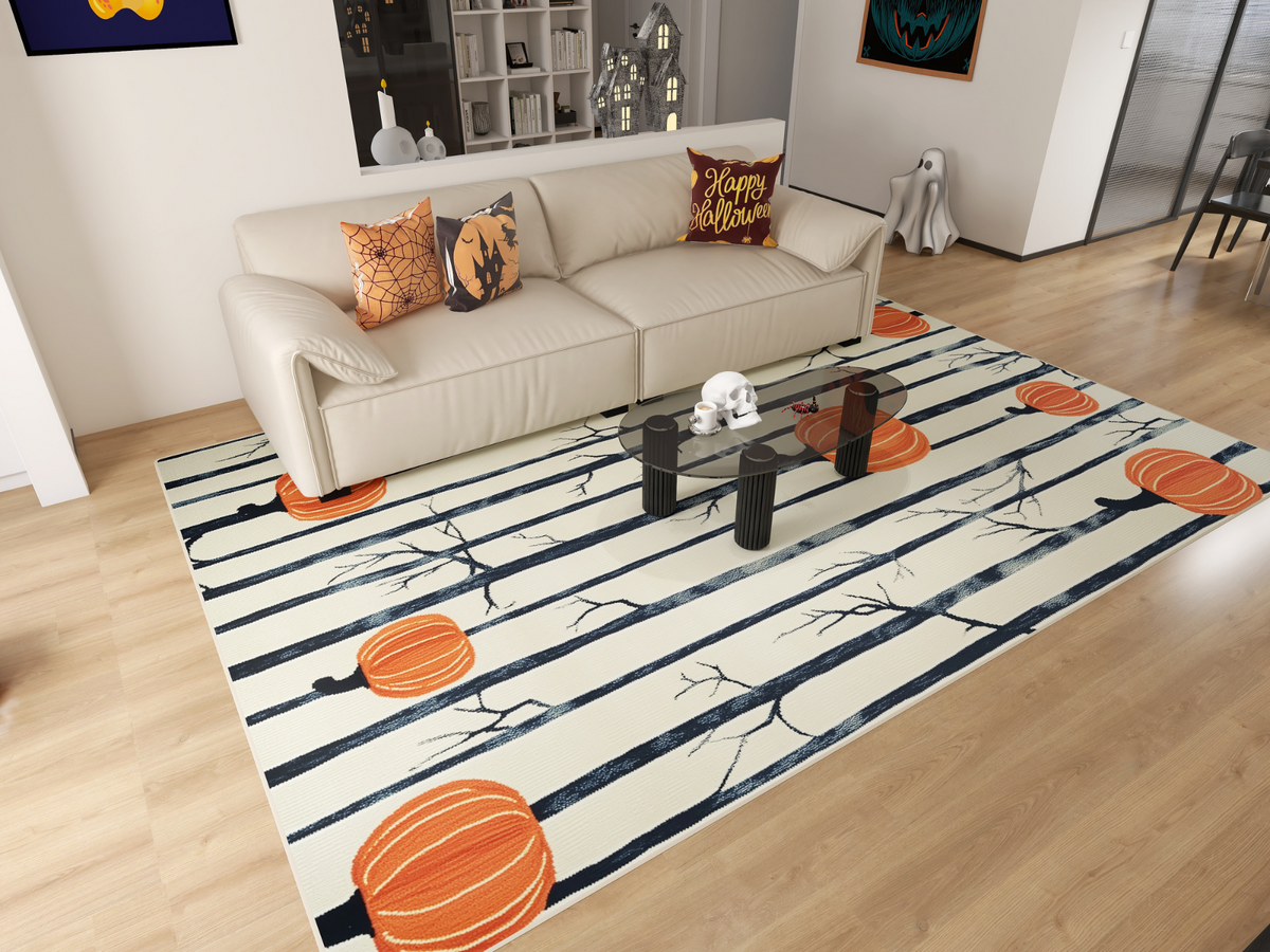 A living room features Halloween decor: a beige sofa with festive pillows, the Pumpkin Grove - Washable Rug - HLW002 (Custom Size) with pumpkin pattern, a glass table with skulls, themed wall art, and a white ghost figure by the wall.