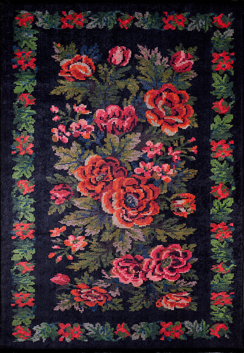 The Radiant Bloom - Washable Rug - JR294 (Custom Size) showcases bold red and pink flowers with green leaves on a black background, finished with a matching floral border—durable and perfect for high-traffic areas.