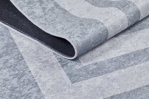 Load image 1 in gallery view. A close-up of the Refined Edge - Washable Rug - JR573 (Custom Size) in textured gray-anthracite, featuring a subtle geometric pattern and contrasting dark backing—ideal for high-traffic areas.