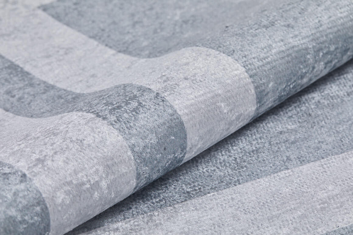 Close-up of the Refined Edge - Washable Rug - JR573 (Custom Size), featuring a soft, textured gray-anthracite surface with subtle stripes in light and medium gray—durable, velvety, and ideal for high-traffic areas.