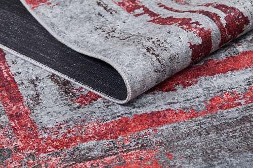 Load image 1 in gallery view. A close-up of the Refined and Timeless - Washable Rug - JR1500 (Custom Size) shows its gray and red abstract distressed pattern, black underside, and folded corner—ideal for high-traffic areas.